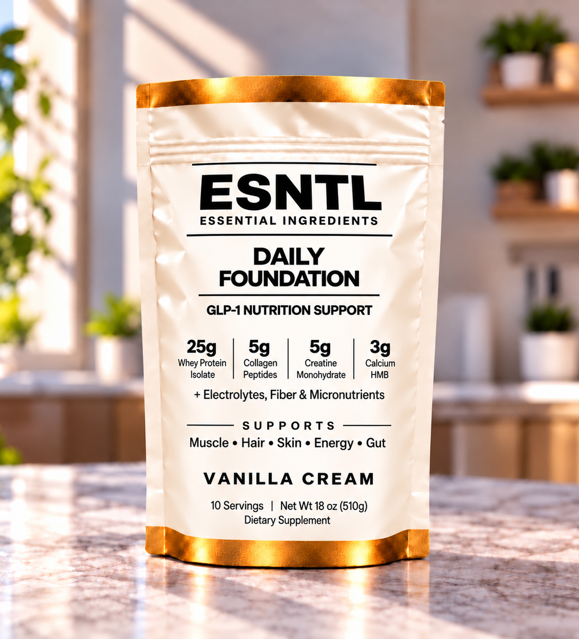 ESNTL Daily Foundation Vanilla Cream pouch standing on a marble kitchen counter in sunlight.